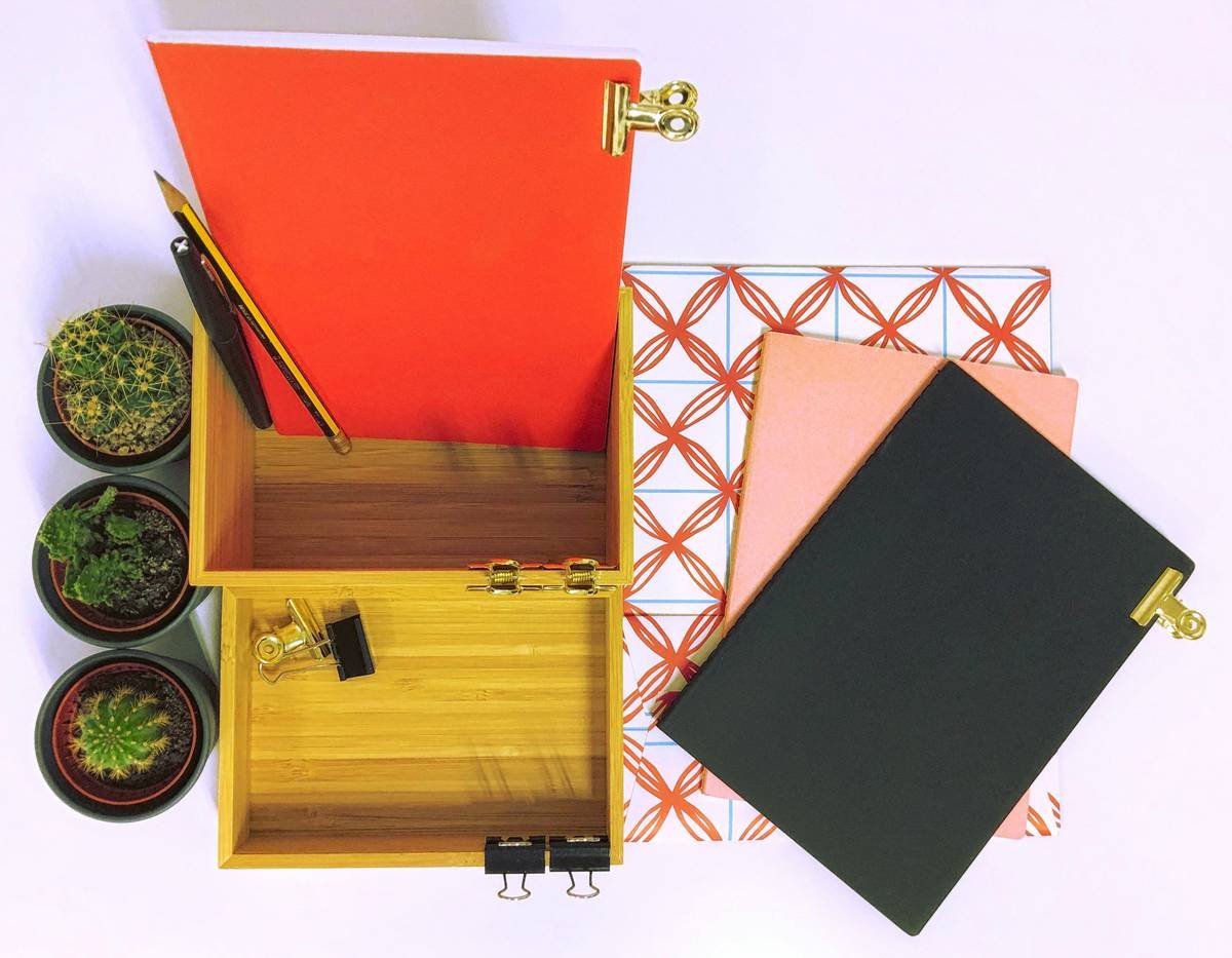 Side-by-side photo: left shows chaotic makeup scattered on vanity; right shows same products neatly arranged in a bamboo beauty organization holder with labeled compartments